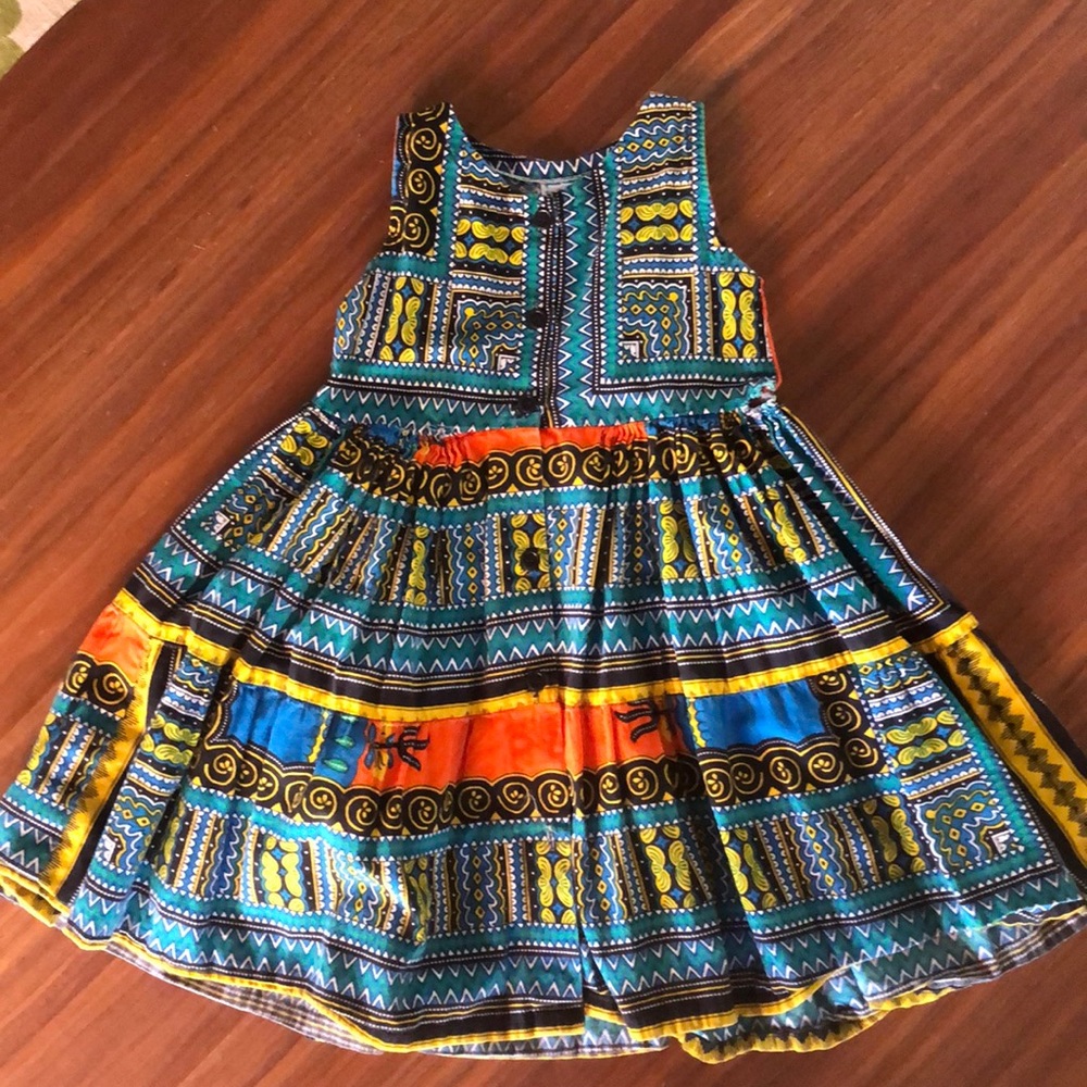 Adorable girls sun dress with bohemian flair.